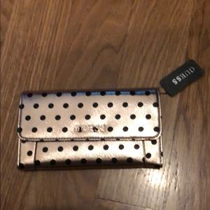 Rose gold and black polka dot GUESS wallet